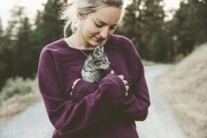 Woman holding kitten | Pet Partners