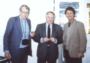 Leo Bustad and Michael McCulloch pose with an unnamed individual at a Delta Society meeting.