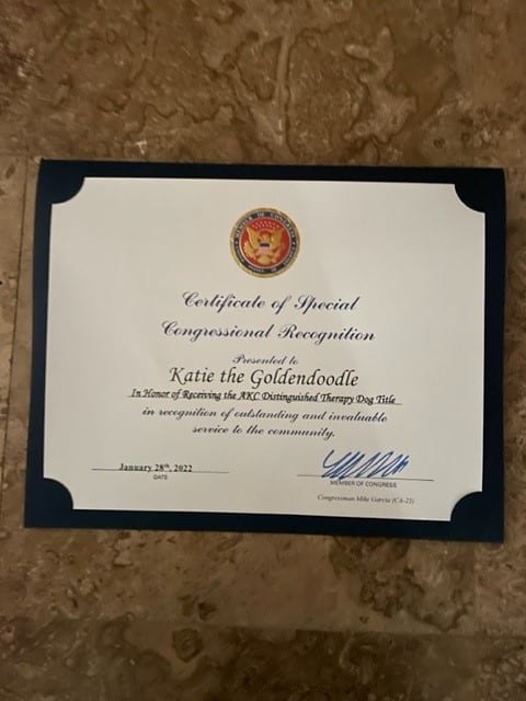 A certificate of recognition for Katie the goldendoodle from U.S. Representative Mike Garcia.