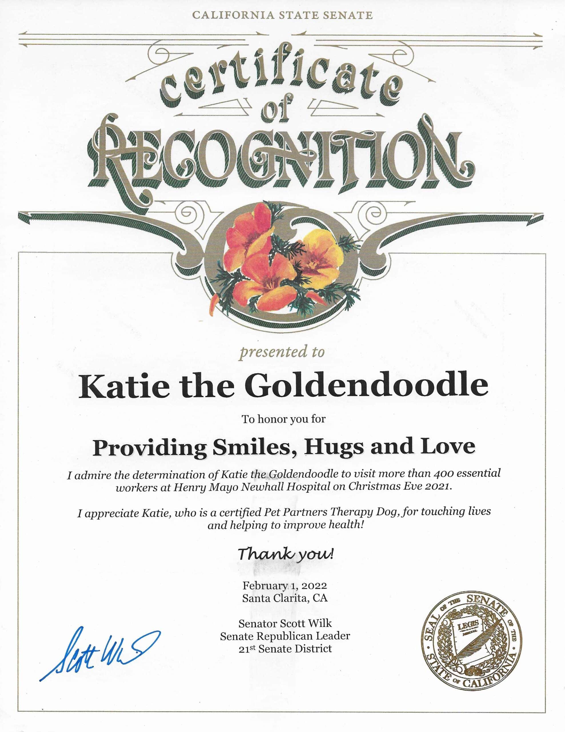 A certificate of recognition for Katie the Goldendoodle from California state Senator Scott Wilk.