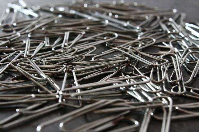 Closeup of a pile of silver paper clips. Image by PDPics from Pixabay