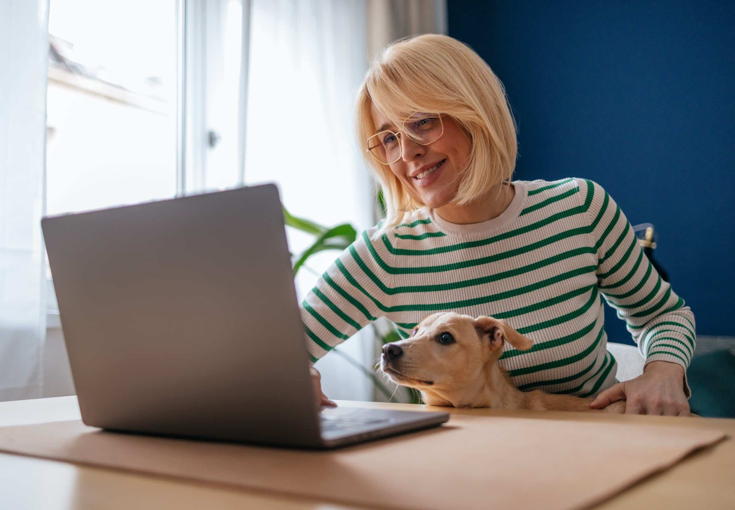 Woman and dog at computer